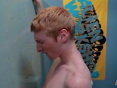 Twink in a baseball cap swallows gloryhole cock