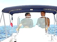 Two hot guys spending hot summeer day driving the boat