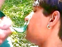 Twink makes a blowjob to his lover in the park