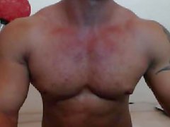 Bodybuilder flexs and eats his cum on webcam