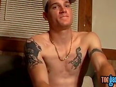 Inked jock Glock shows off feet and wanks for cumshot