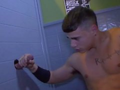 Hunks suck and screw through a bathroom gloryhole