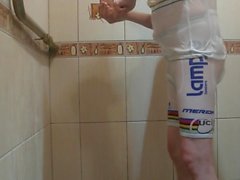 Masturbating under shower in white bicycle clothing