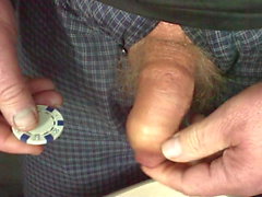 Foreskin with casino chip and table tennis ball - and piss
