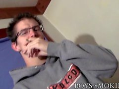 Nerdy stud Lex exhales smoke during masturbation